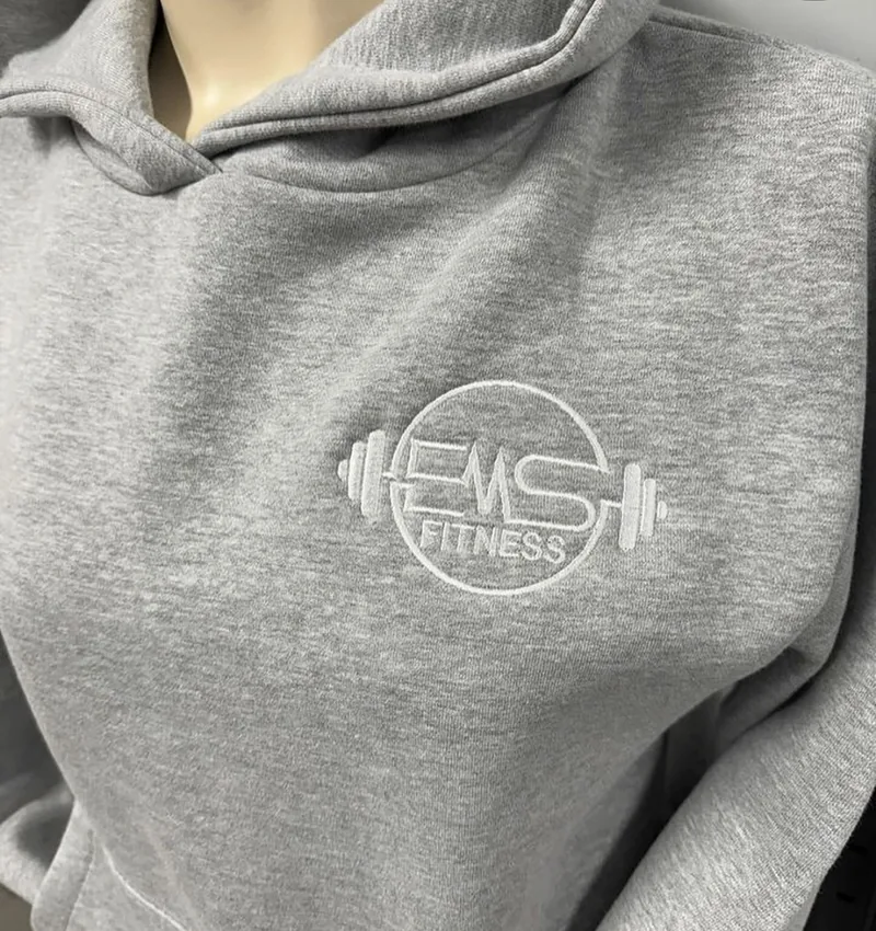 Close-up of the embroidered EMS Fitness chest logo